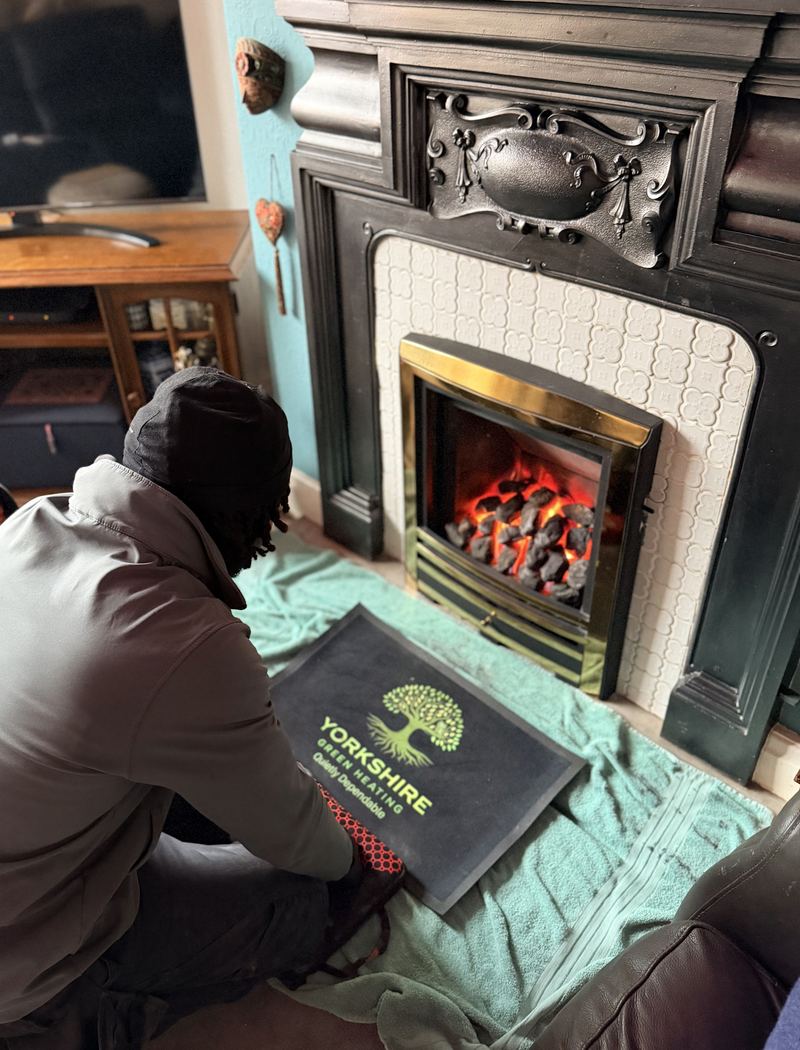 Yorkshire Green Heating engineer working on a living-flame gas fire