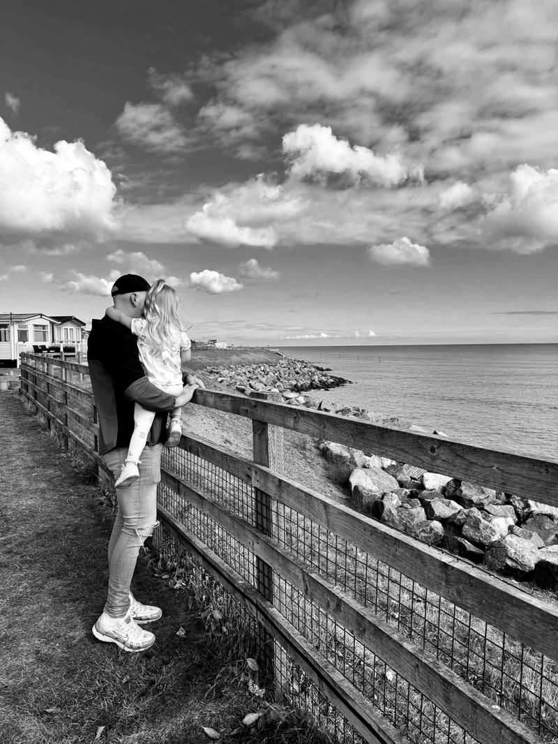 Ashley at the coast with his daughter