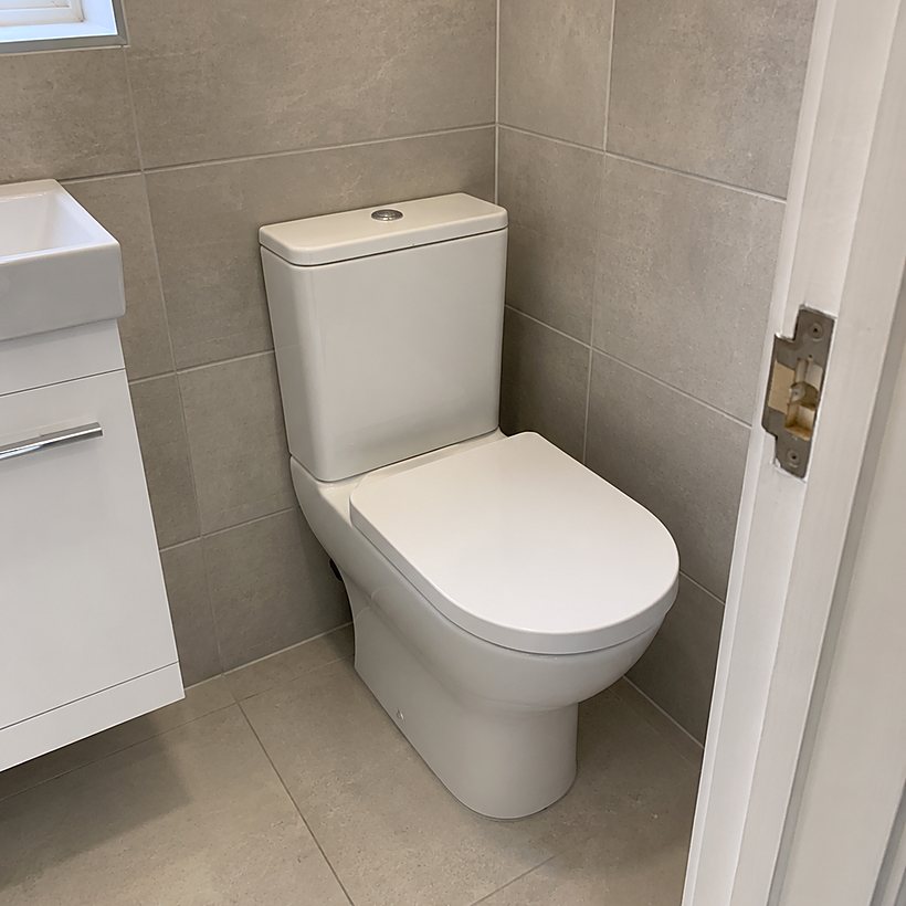 Modern white toilet fitted by Yorkshire Green Heating in Doncaster
